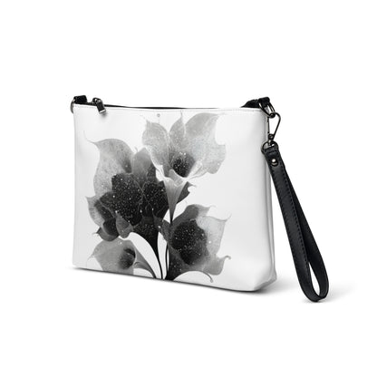 Sac en bandoulière minimaliste avec design floral épuré et détails gris foncé.