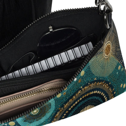 Intérieur du sac en bandoulière avec poches zippées pour organiser vos essentiels.