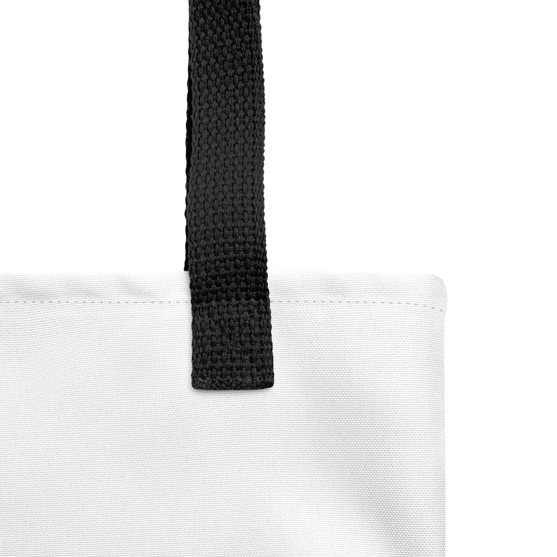 Gros plan des poignées noires en denim naturel du tote bag Super Rainette 2